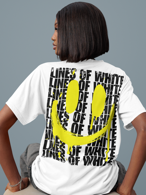 Acid Drip back-print tee by Lines Of White — back view, worn by a woman in a studio