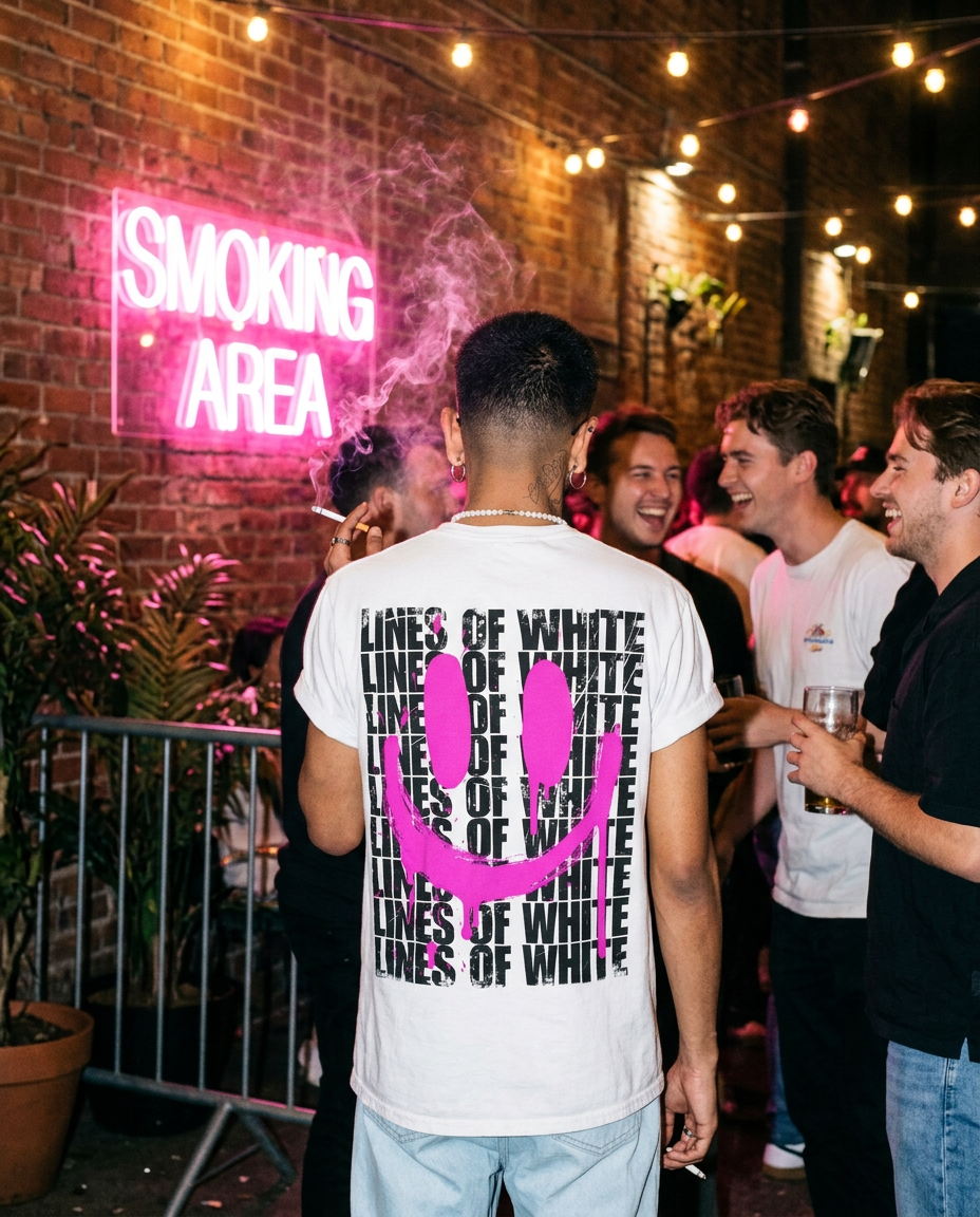 Acid Drip Smiley pink t-shirt back print in a club smoking area under pink neon light