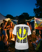 Acid Drip Smiley yellow t-shirt back print at a festival campsite afterparty at dusk